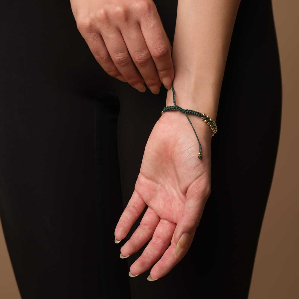 Armband geflochten mit Kauri Muschel gold dunkelgrün