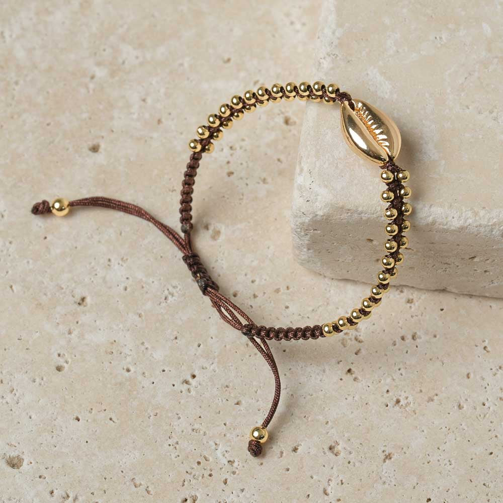 Armband geflochten mit Kauri Muschel gold espresso